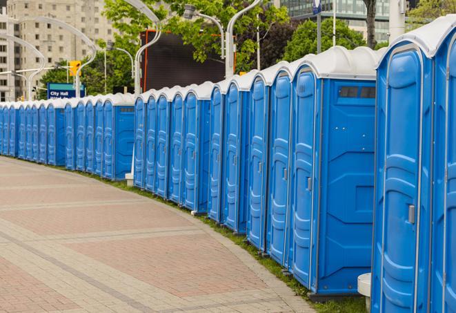 hygienic portable restrooms lined up at a beach party, ensuring guests have access to the necessary facilities while enjoying the sun and sand in Evanston IL